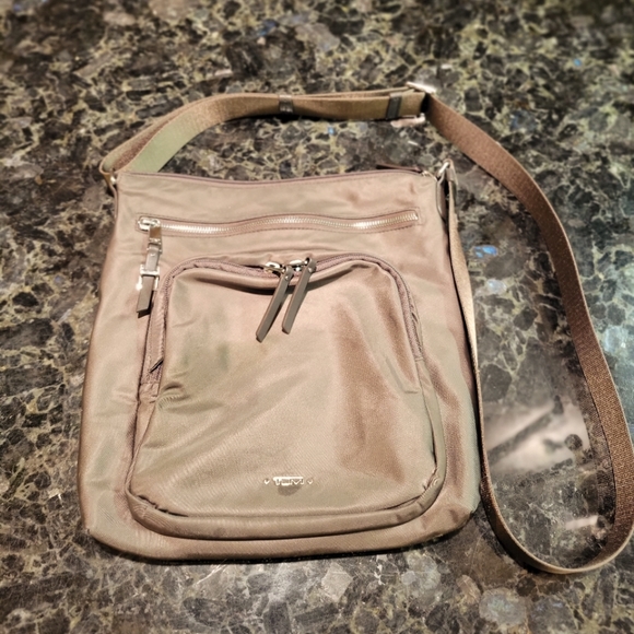 Tumi Bags Tumi Voyageur Carmel Crossbody In Mink And Silver Poshmark